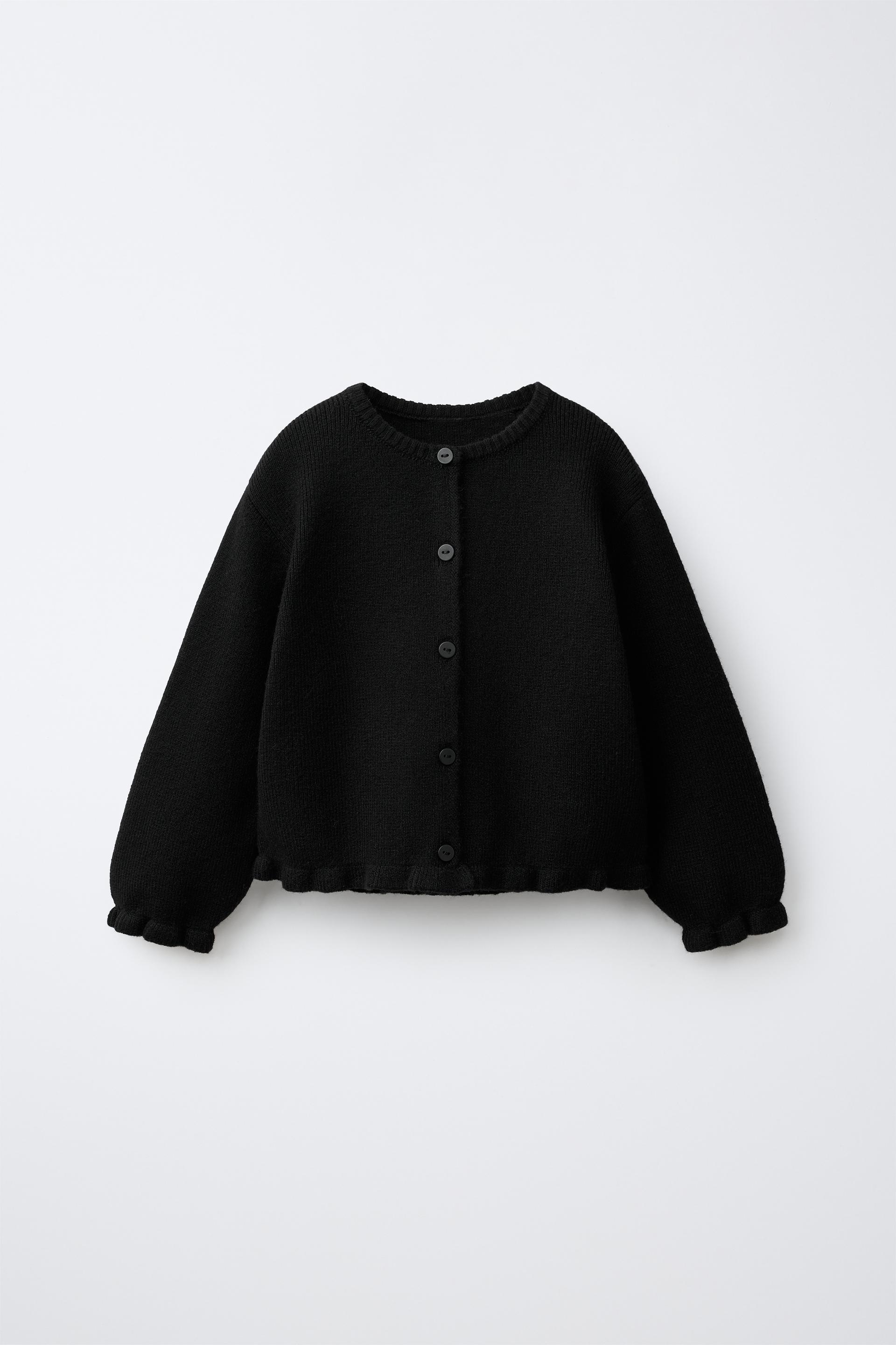 STRICKJACKE MIT VOLANT